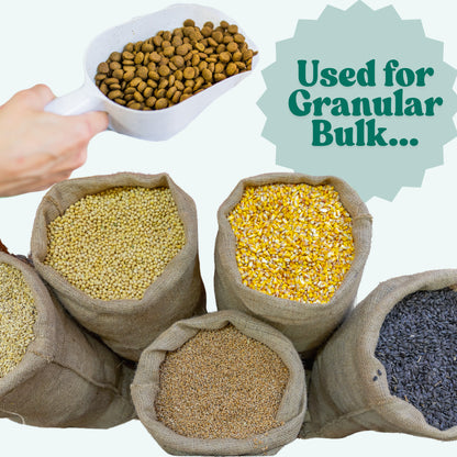 PP plastic measuring scoop filled with granular bulk material, showing it's suitable for scooping powders or dry goods.